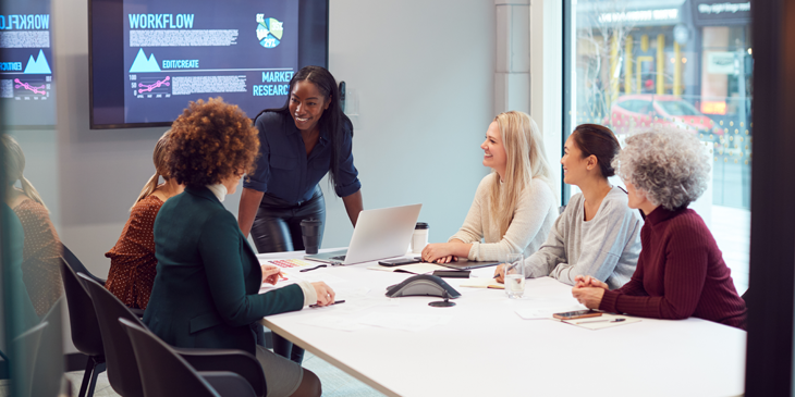 Women convening a meeting in an office
