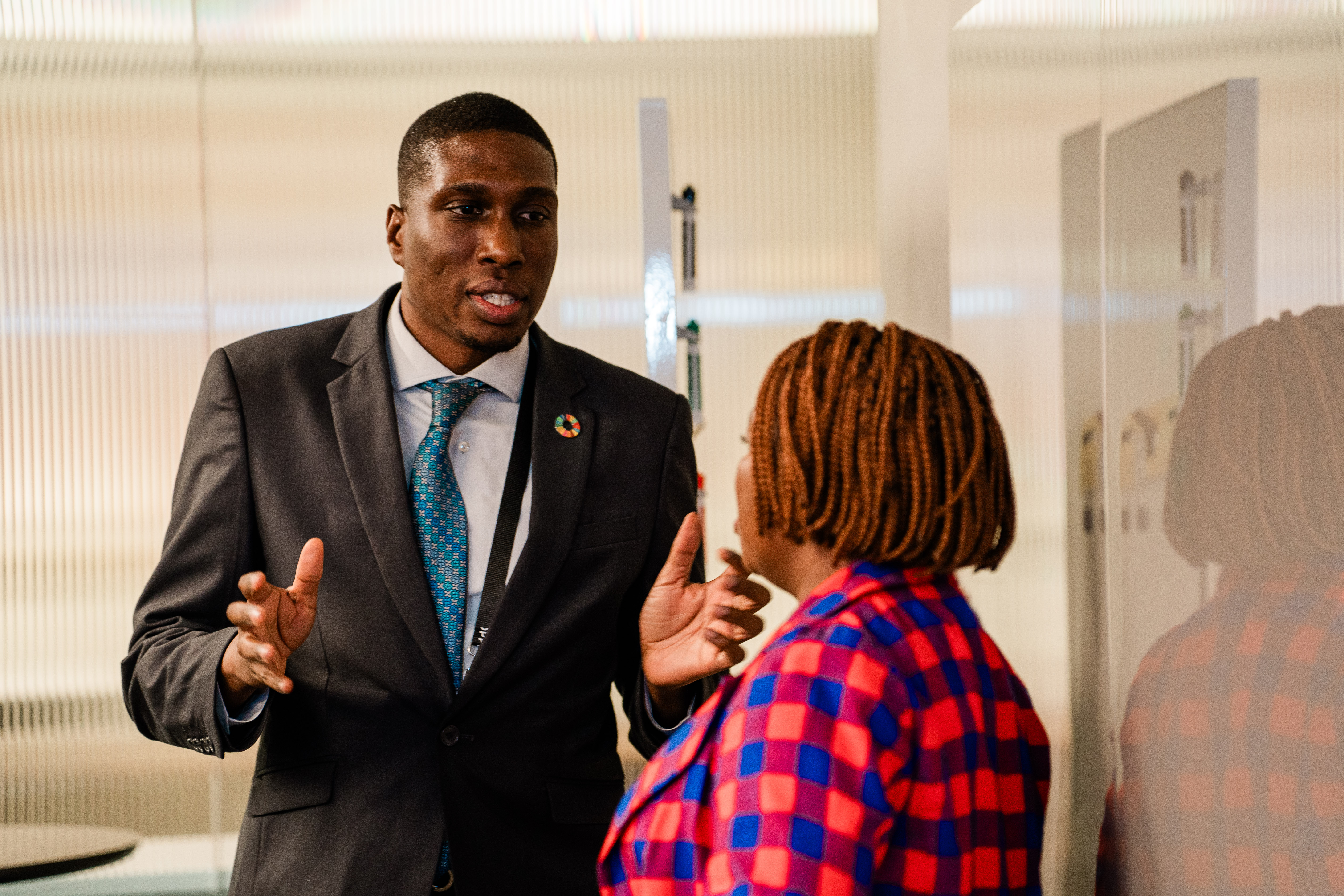 Tolu Kweko Lacroix and a colleague speaking