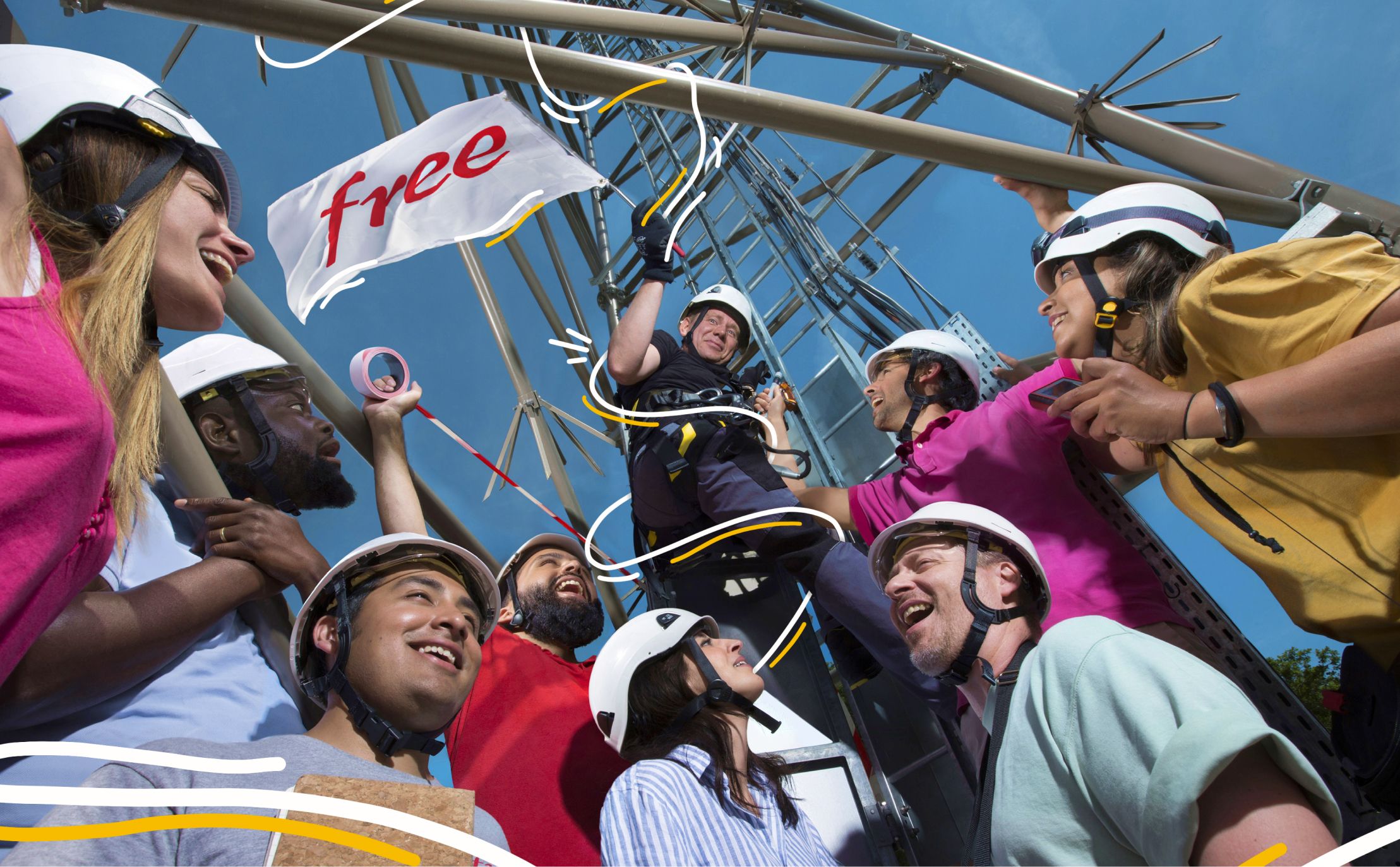 A group of people waving a flag at the top of a tower