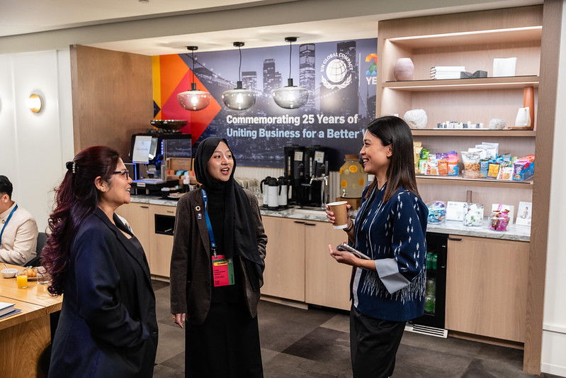 Three participants at Leaders Summit conversing