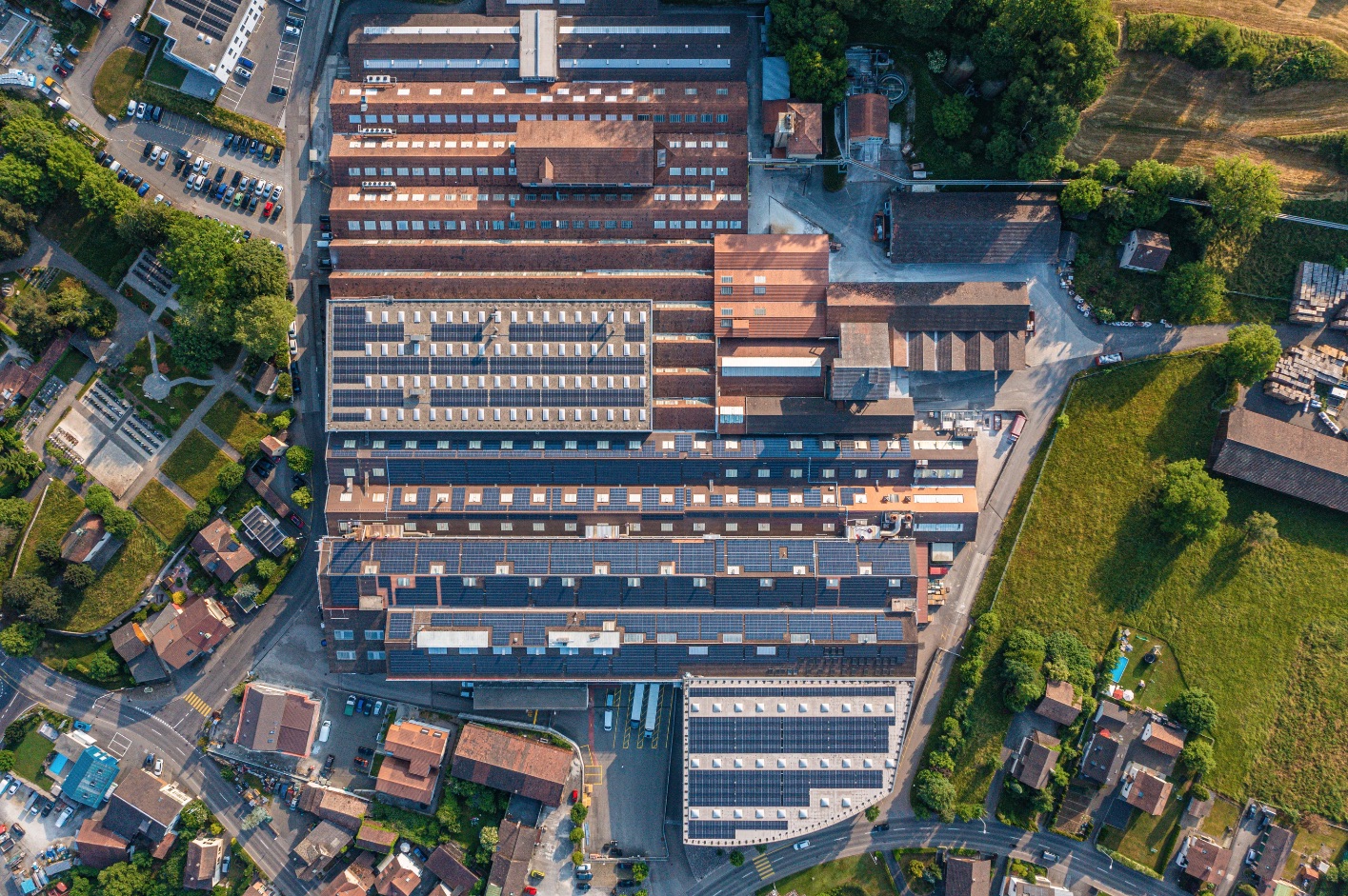 Topview from industrial plant with solar panels int the roof
