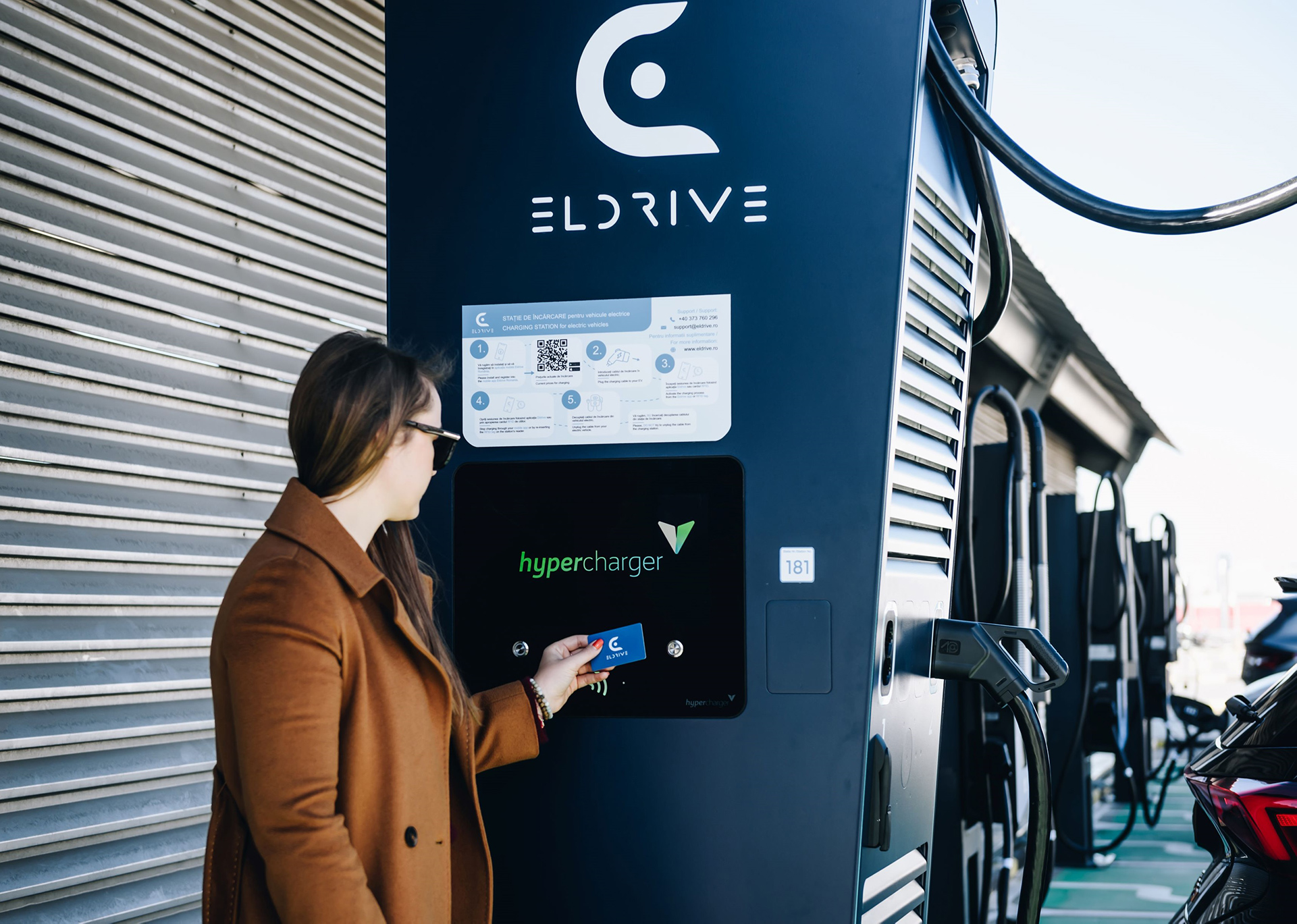 Woman using electric station for charge electric car