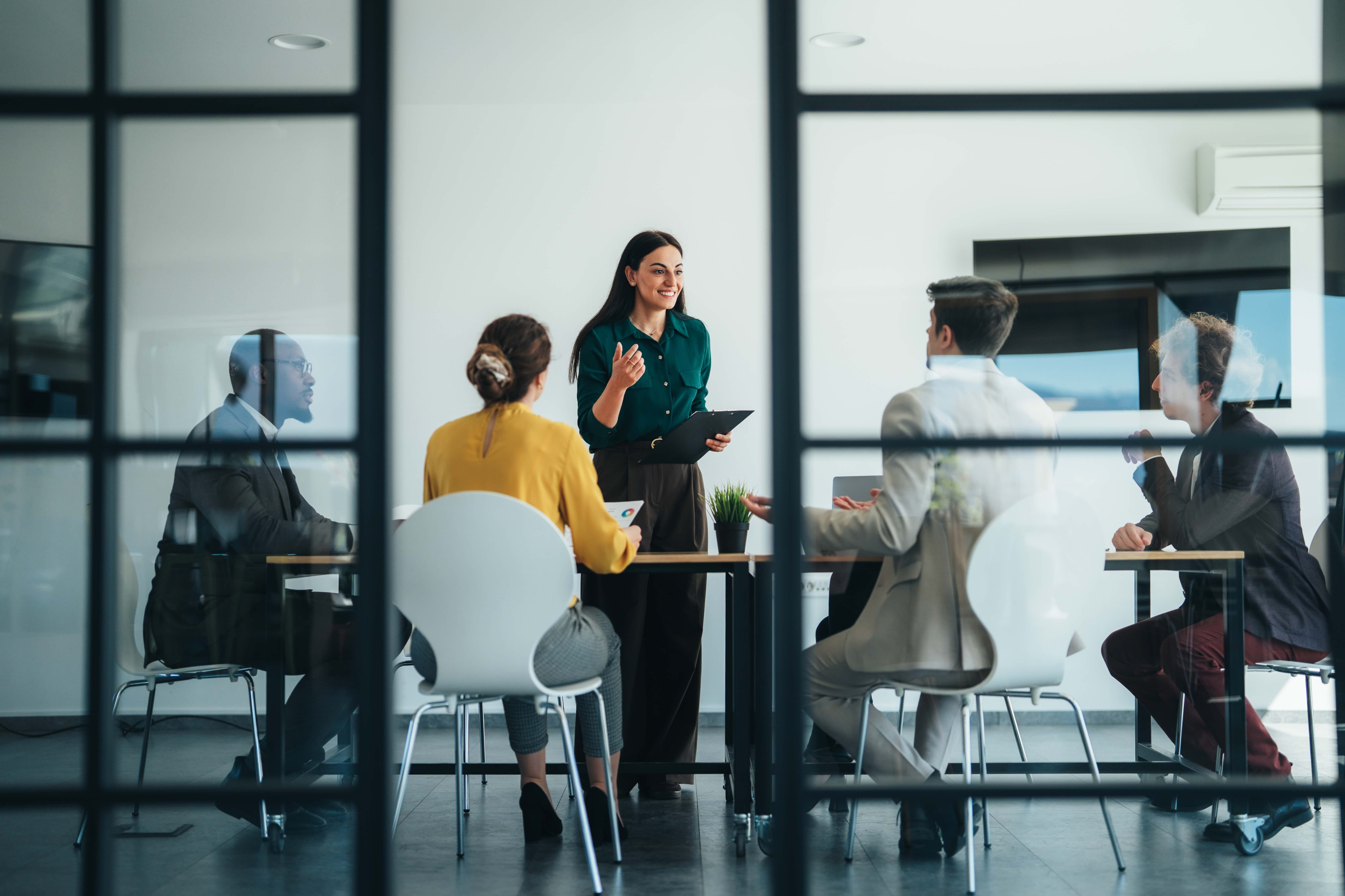 people talking in board room