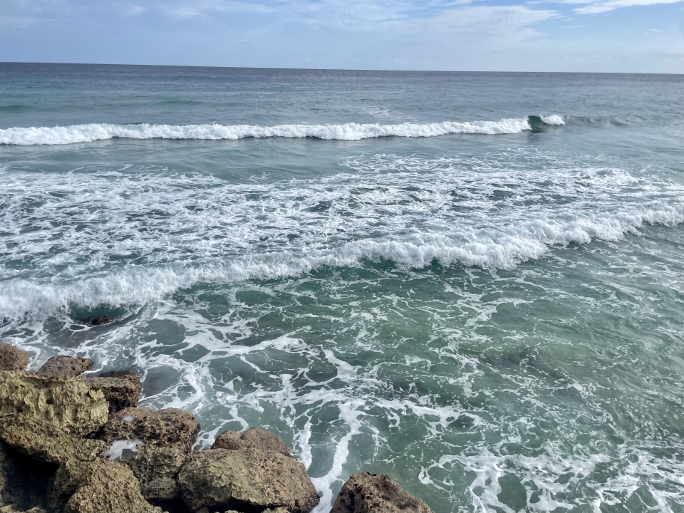ocean surf crashing on rocks