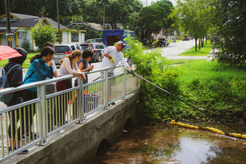 People cleaning a river